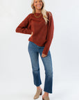 Cozy Take It Easy Rust Pullover Sweater paired with cropped jeans and leopard mules, perfect for a casual fall outfit.