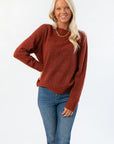 Take It Easy Rust Pullover Sweater with crew neckline and ribbed hem, styled for fall in cozy knit fabric. Ideal for layering with jeans.