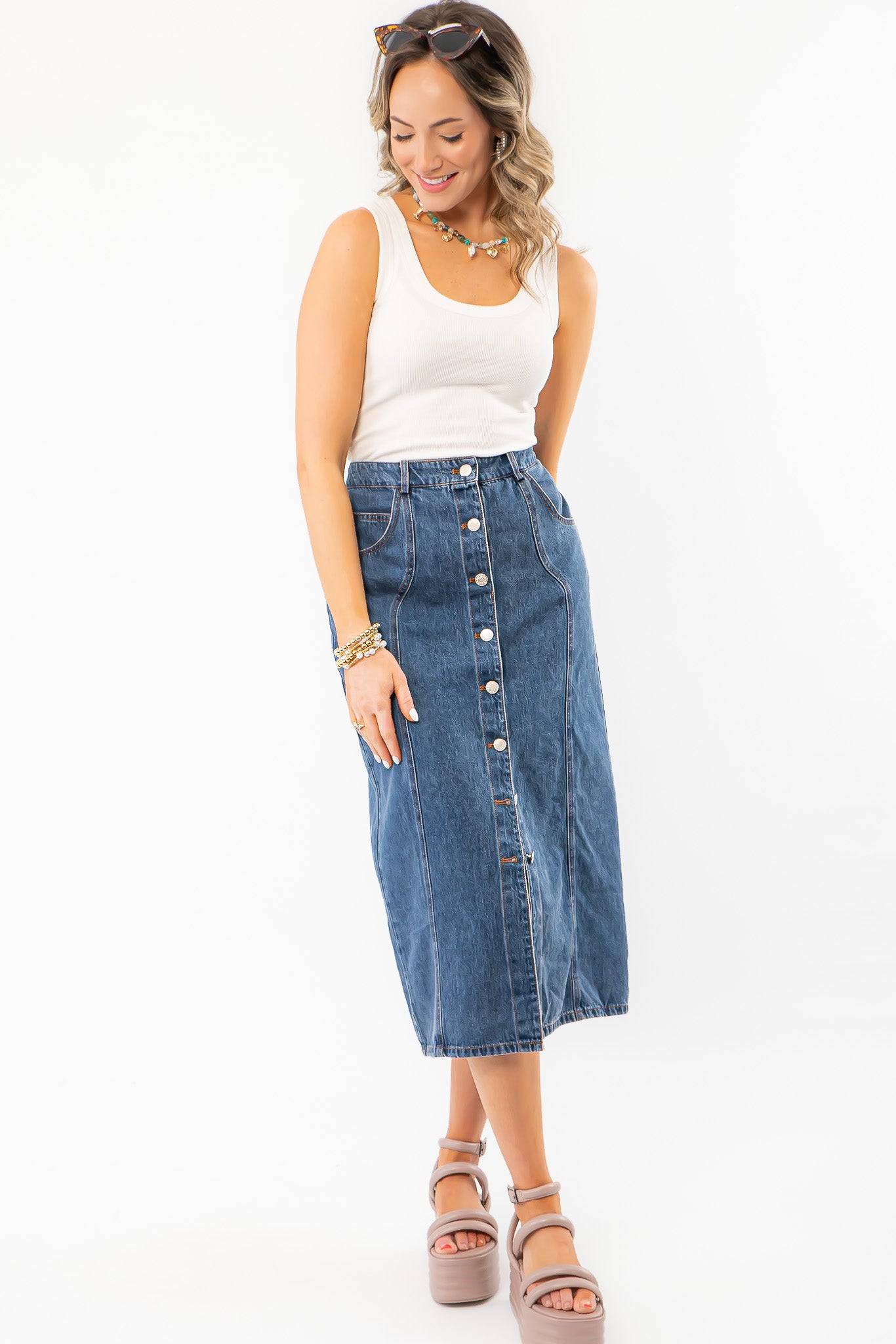 Model wearing Thick Strap Ribbed Off White Basic Tank with denim skirt and platform sandals, perfect for a relaxed summer outfit.