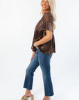 Side profile of Lacy Brown Velvet Babydoll Top showing flowy silhouette and soft velvet fabric. Perfect trendy top for fall and holiday outfits.