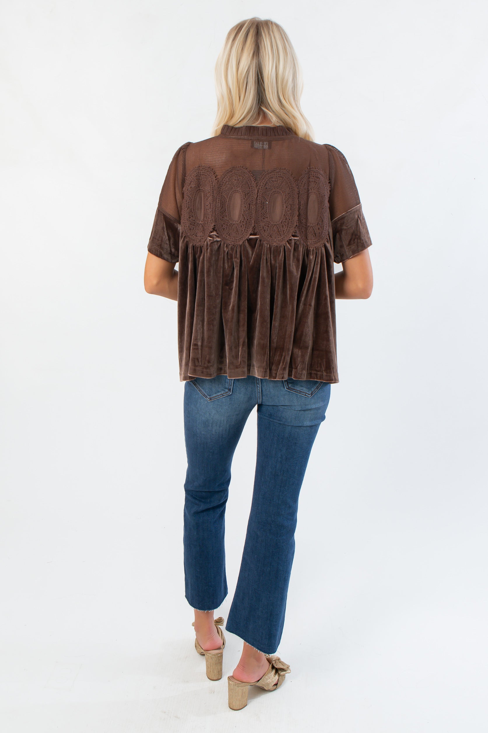 Back view of Lacy Brown Velvet Babydoll Top with intricate lace panel and pleated velvet design. Stylish fall blouse for denim or skirts.