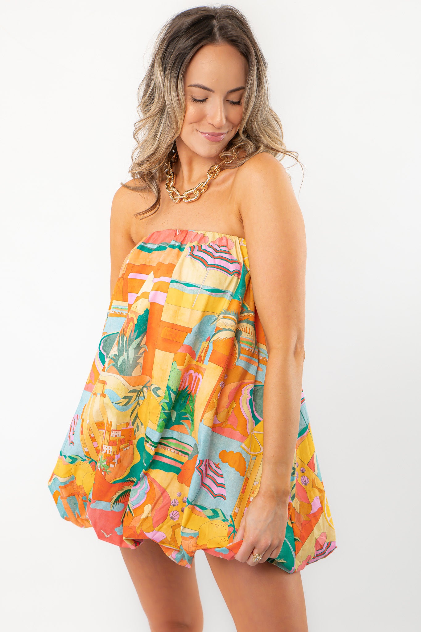Show Me Your Mumu Postcards From Italia Bubble Dress featuring a strapless A-line silhouette with vibrant vacation-themed prints and bubble hem.
