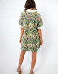 Back view of Martha’s Botanical Garden Collared Dress with pleated detail and short sleeves, highlighting its elegant floral spring pattern.