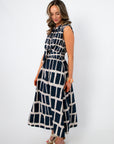 Angled view of Newport Knot-Front Navy Midi Dress highlighting the cinched waist and breezy midi length, perfect for brunch or vacation looks.