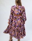 Back view of Jod Purple Multi Print Maxi Dress showcasing tiered layers and comfortable fit for seasonal styling.