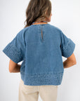 Indigo Daydream Chambray Denim Top | Back view showing keyhole button closure and textured hem, a trendy addition to any denim wardrobe.