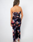 Back view of Amethyst Petal Mesh Maxi Dress with ruched detailing and back slit, showcasing a flattering fit for elegant spring and summer events.