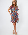 THML Tropadelic Short Sleeve Dress in Tropical Geo Stripe with vibrant multicolor pattern, relaxed shift fit, and front button detail.