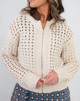 Close-up of Z Supply Crystal Logan Sweater Jacket showing textured open-knit design and front zipper. Ideal for versatile spring outerwear styling.