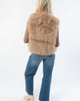 Back view of Fifth Avenue Taupe Faux Fur Vest highlighting its cozy faux fur design. Ideal boutique outerwear for layering in cool weather.