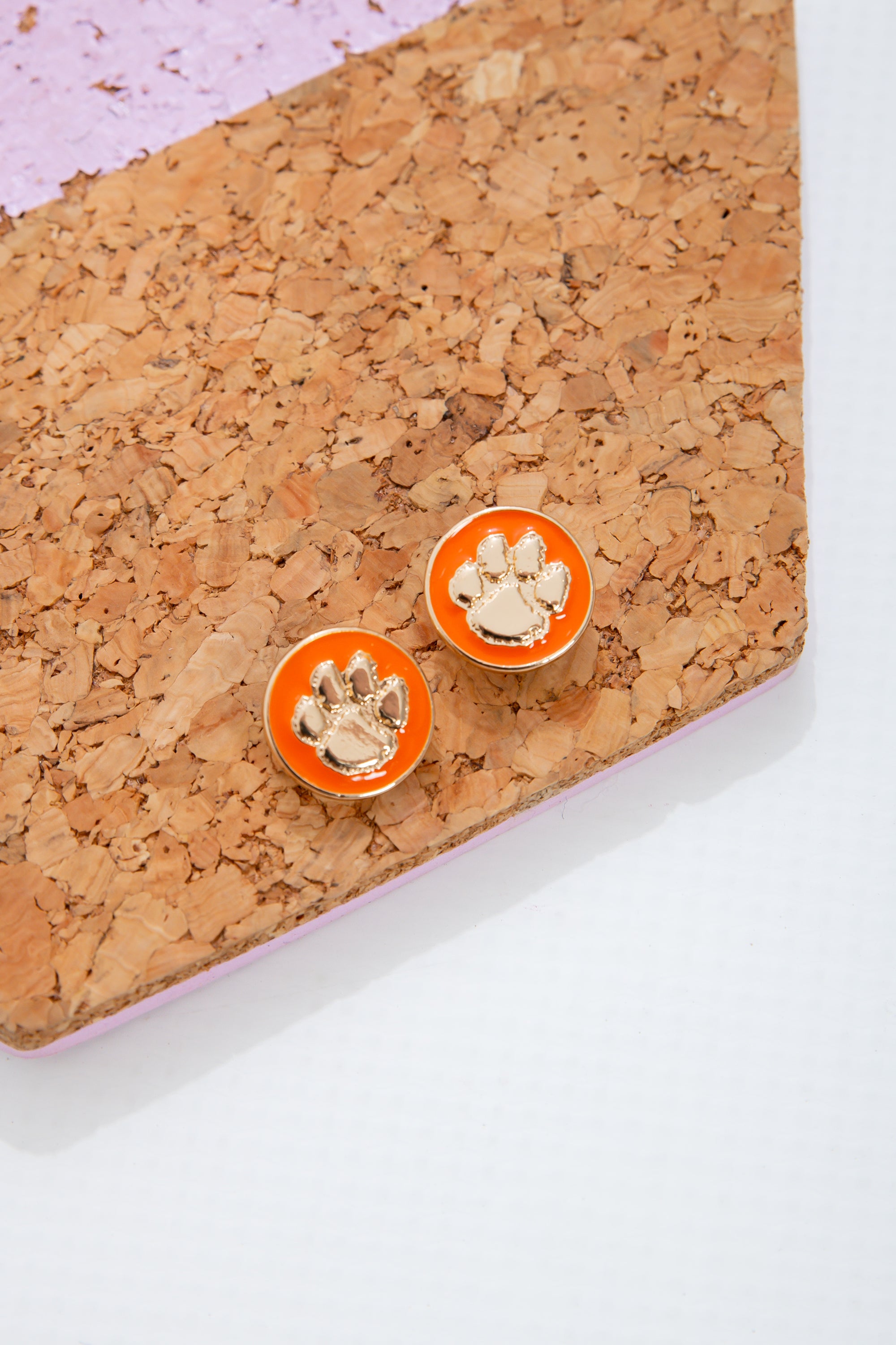 Clemson Tigers Earrings - Circle Stud featuring gold-tone paw logo on orange enamel. Perfect jewelry for gameday or showing team spirit daily.
