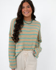 Coastal Spring Stripe Sweater – Lightweight mocha and aqua knit top with long sleeves, styled with cream drawstring pants for spring fashion.