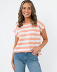 Rosie Peach Stripe Sleeveless Sweater Vest featuring soft blush and white horizontal stripes, perfect for casual spring outfits and travel wear.