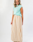 Tiffany Sleeveless Blue Ribbed Knit Top in a relaxed fit, shown with a neutral striped skirt. Ideal for pre-fall wardrobe updates.