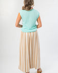 Back view of Tiffany Sleeveless Blue Ribbed Knit Top showcasing ribbed hem detail. A versatile lightweight sweater for fall.