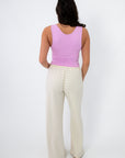 Back view of Free People Pale Orchid Clean Lines Muscle Cami-Stylish & Comfortable Sleeveless Top, showing racerback-style fit and smooth finish.