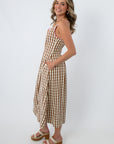 Side view of THML Pink & Chocolate Brown Gingham Midi Dress with pink trim, sleeveless, midi length, casual chic