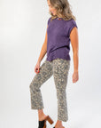 Side angle of Tiffany Sleeveless Purple Ribbed Knit Top showing relaxed fit and ribbed hem, styled for casual fall fashion.