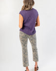 Back view of Tiffany Sleeveless Purple Ribbed Knit Top highlighting lightweight knit texture and loose fit for pre-fall styling.