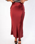 Close-up of the Cabernet Crush Satin Midi Skirt showcasing its smooth satin texture and flattering bias-cut silhouette.