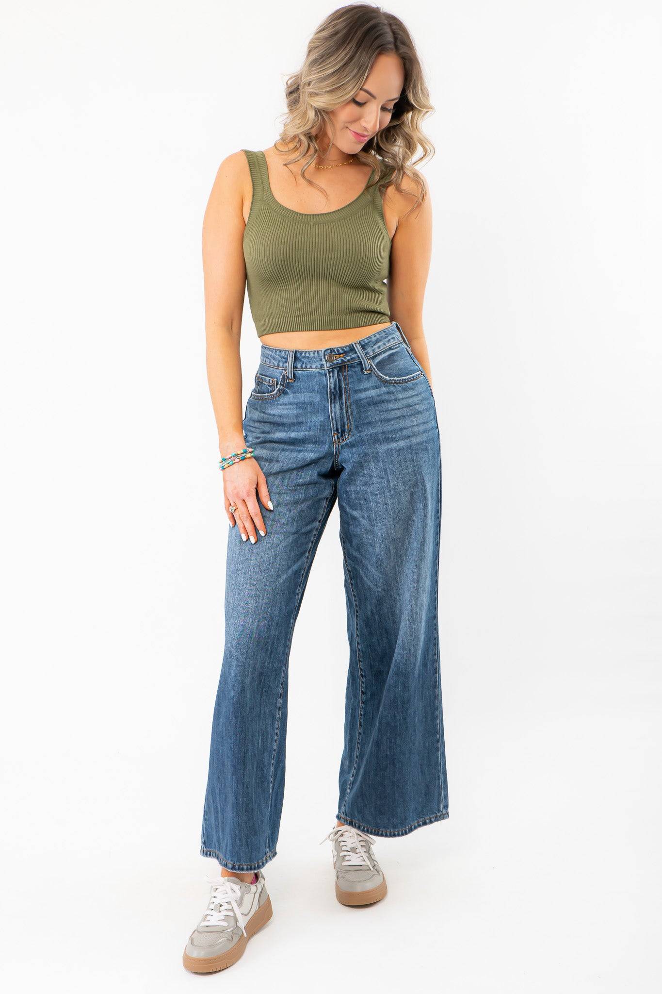 Olive Seamless Cropped Brami styled with high-waisted wide-leg jeans, perfect for summer activewear or casual layering.