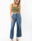 Olive Seamless Cropped Brami styled with high-waisted wide-leg jeans, perfect for summer activewear or casual layering.
