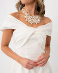 Elegant white mini dress with off-shoulder draped neckline for party wear