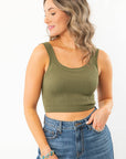 Olive Seamless Cropped Brami - A Summer Essential, featuring a ribbed texture and scoop neckline, styled with high-waisted denim jeans.
