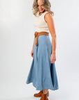 Side view of Washed Denim Paneled Midi Skirt paired with a woven belt and ankle boots, ideal for autumn layering.