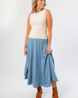 Polly Cream Knit Sleeveless Top with boat neck and long hem, paired with a flowy denim skirt, perfect knit tank for fall layering.
