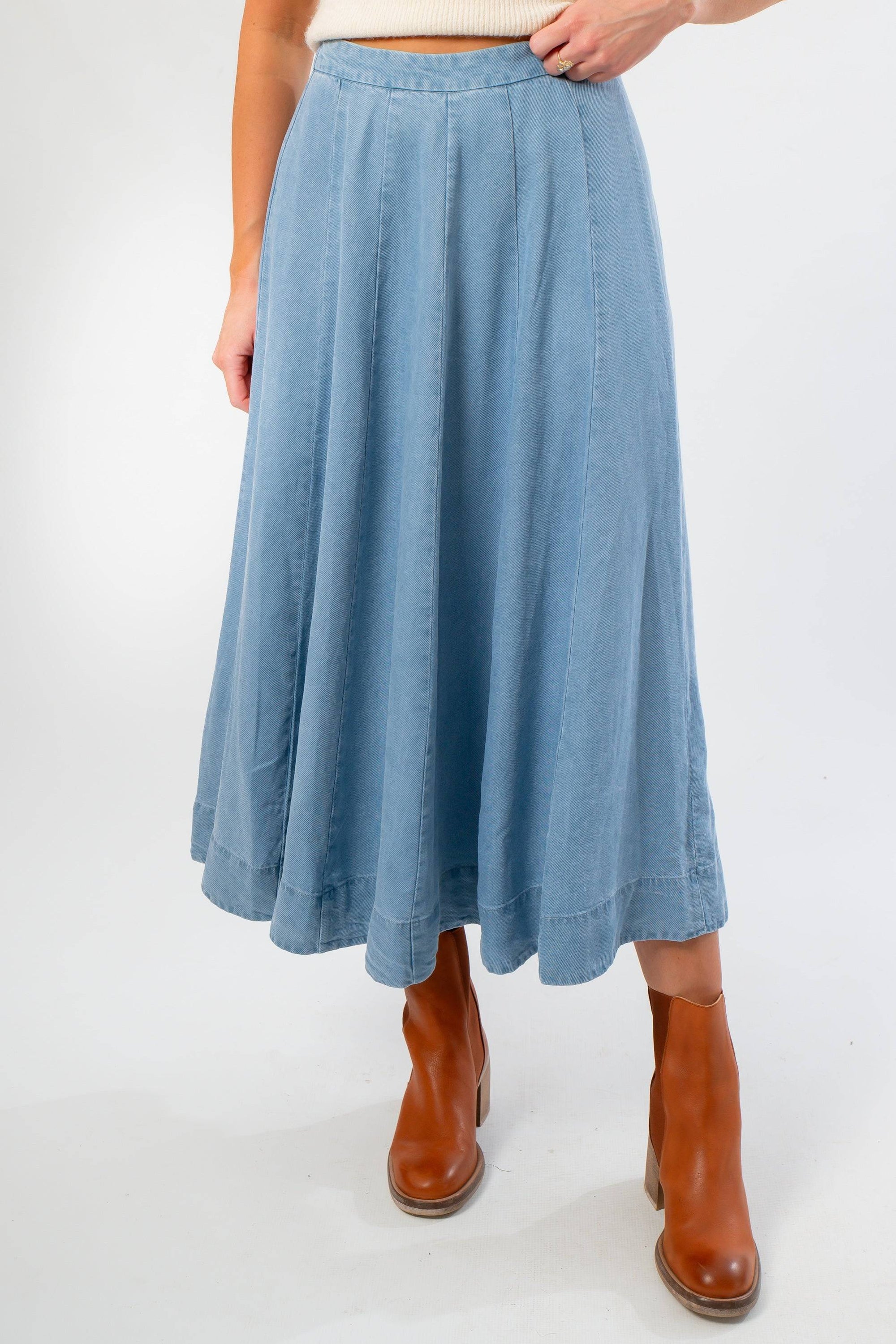 Close-up of Washed Denim Paneled Midi Skirt showing soft fabric, flowy silhouette, and paneled detailing for a flattering fit.