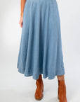 Close-up of Washed Denim Paneled Midi Skirt showing soft fabric, flowy silhouette, and paneled detailing for a flattering fit.
