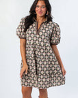 Close-up of Brianna Chocolate Floral Puff Sleeve Mini Dress showcasing detailed floral pattern and flattering neckline for autumn fashion.