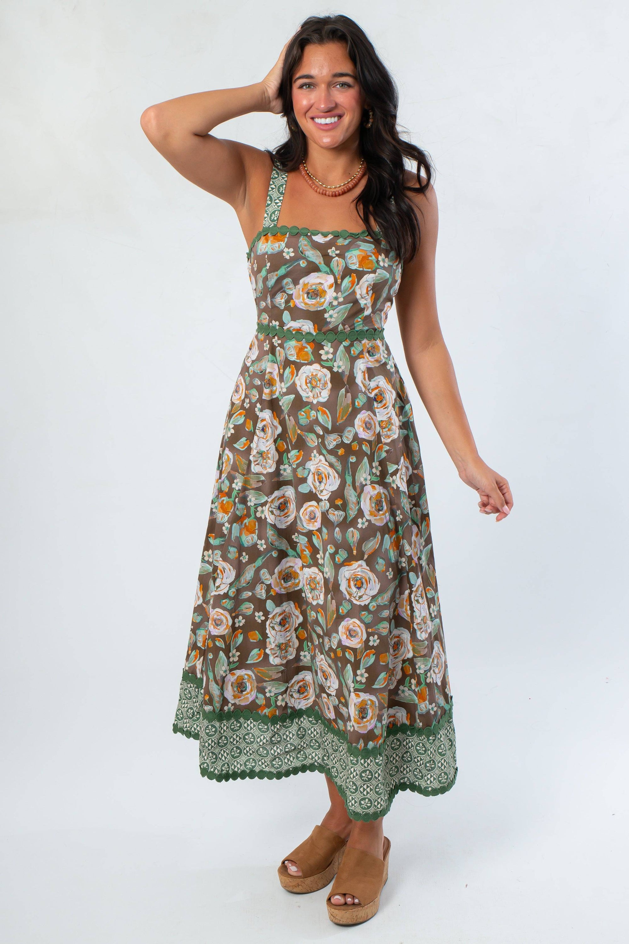 Floral Midi Dress - Brown Sleeveless with square neckline, adjustable straps, and green floral hem, styled for fall casual wear.