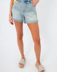 Full front view of Kut from the Kloth Wonder Taylor High Rise Short styled with casual sandals, ideal for warm-weather outfits.