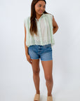 Eyelet Lace Blouse in seafoam mint green styled with denim shorts