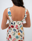 Close-up of the back of the Show Me Your Mumu French Floral Emily Mini Dress highlighting the vivid floral print and square neckline detail.