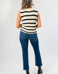 Back view of Oreo Striped Sleeveless Sweater featuring horizontal black and white stripes, styled for casual fall fashion.