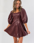Trendy Bordeaux Bliss Faux Leather Dress in wine red with square neckline and short hem, perfect for festive occasions or night outs.