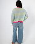 Back view of Cabana Stripe Lightweight Sweater with mint and sky blue stripes and pink hem, highlighting breathable knit fabric and casual fit.