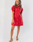 Sugarplum Showgirl Red Faux Leather Mini Dress with puff sleeves and front seam detail, ideal for holiday parties or festive occasions.