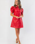 Vegan-friendly Sugarplum Showgirl Red Faux Leather Mini Dress featuring a short hemline and structured silhouette, perfect for statement holiday looks.