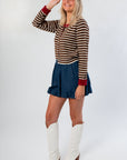 Side view of Jenna's Brown Burgundy Stripe Cardigan, showcasing its fitted knit design and versatile layering style for tops category.