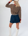Back view of Jenna Brown & Burgundy Stripe Cardigan highlighting horizontal stripes and ribbed hem, styled for casual or gameday wear.