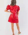 Back view of Sugarplum Showgirl Red Faux Leather Mini Dress with pleated detail and puff sleeves, a chic choice for festive and occasion wear.
