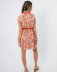 Back view of Paloma Please Scallop Appliqué Sleeveless Dress in rust orange floral, featuring scalloped lace trim and mini length design.