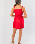 Back view of Noelle Red Bow Square Neck Mini Dress with adjustable straps and clean lines, a chic choice for holiday and occasion wear.