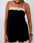 Black and cream scallop tank with adjustable straps and matching shorts for neutral game day look