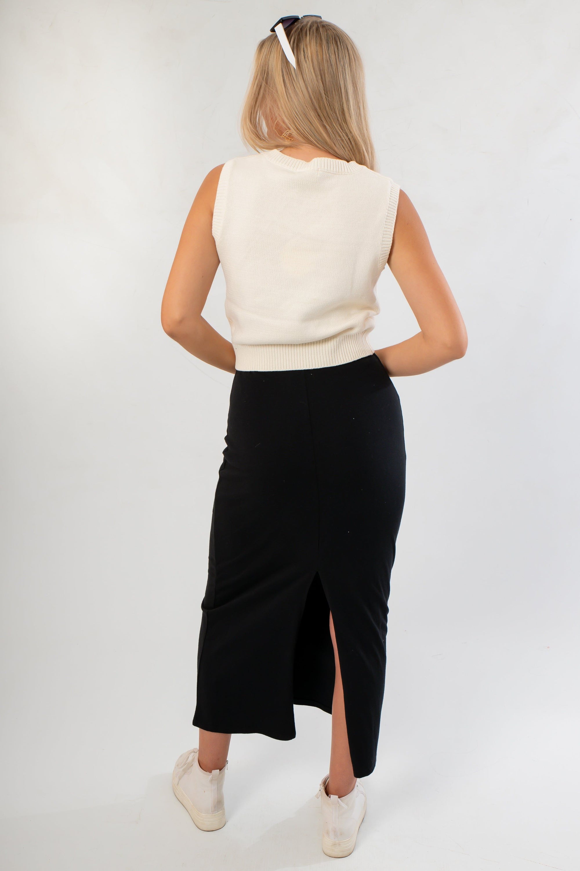 Back view of Ned Bedazzled Sleeveless Football Sweater showing ribbed knit texture and clean sleeveless cut for sporty-chic appeal.