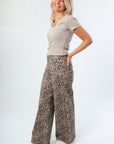 Side view of Z Supply Heather Taupe Sirena Rib Tee highlighting its slim fit and soft ribbed texture, styled with printed lounge pants.
